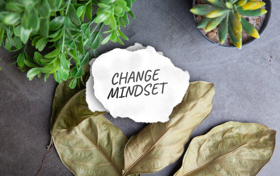 Torn Paper Note Displaying Change Mindset Text on Leaves