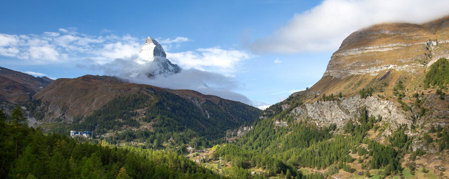 Matterhorn snow mountain peak and alpine panorama with village and ski lifts, Switzerland, Swiss Alps