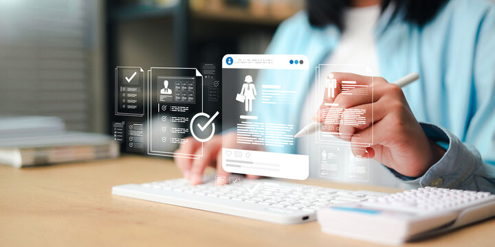 Recruitment and human resources concept showing a professional reviewing digital employee profiles, hiring documents,