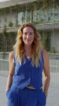 Successful businesswoman smiling at camera outdoors