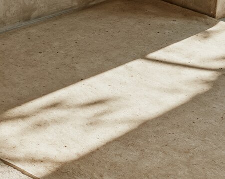 Aged parchment paper with a tactile fibrous grain and a soft daylight beam, providing a weathered beige background for Simchat Torah and Jewish holiday designs