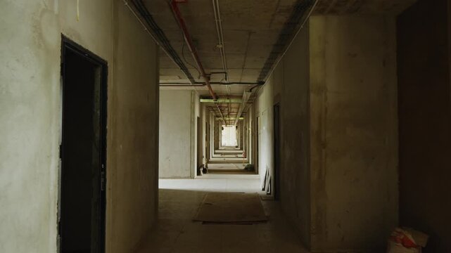 Construction progress of a modern concrete building. Reinforced concrete structure under development, showing structural framework and ongoing construction work.