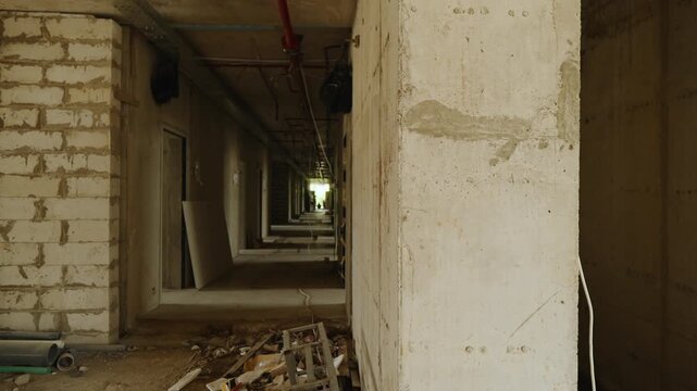 Construction progress of a modern concrete building. Reinforced concrete structure under development, showing structural framework and ongoing construction work.