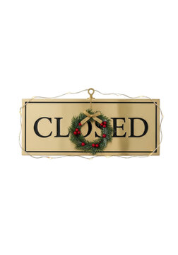 Closed sign with Christmas wreath decoration.