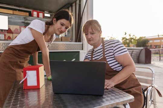 Women small business owners managing their food truck finances