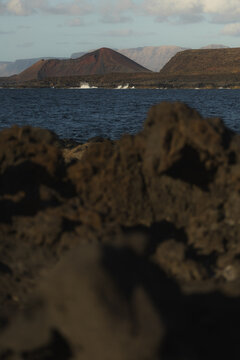 Volcanic Cone Framed by Lava Rocks in Tenesar Lanzarote