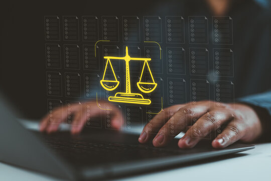 Legal compliance document review uses digital checklists and balanced justice scales. law firm works on laptop for contract auditing, regulatory analysis, risk management, and secure legal workflow.