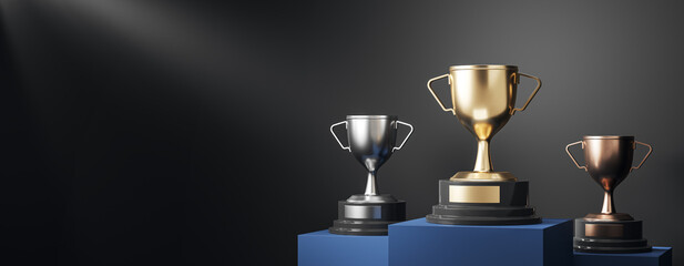 Fototapeta premium Three trophy cups on podiums under a dramatic spotlight, celebrating sports achievement, business success, and competitive excellence. 3D Rendering