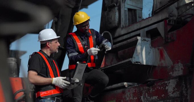  Technicians inspect forklifts engines, conditions in a workshop for repair planning and asset reuse