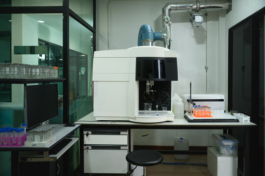 Atomic Absorption Spectrometer in Professional Analytical Chemistry Laboratory with Sample Vials and Computer Workstation