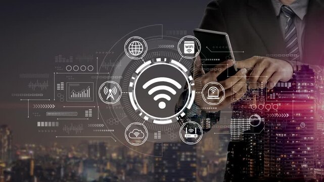 Businessman Using Smartphone with Digital Wireless Connectivity Icons Over City Skyline at Night for Modern Technology Concept. Entropy.
