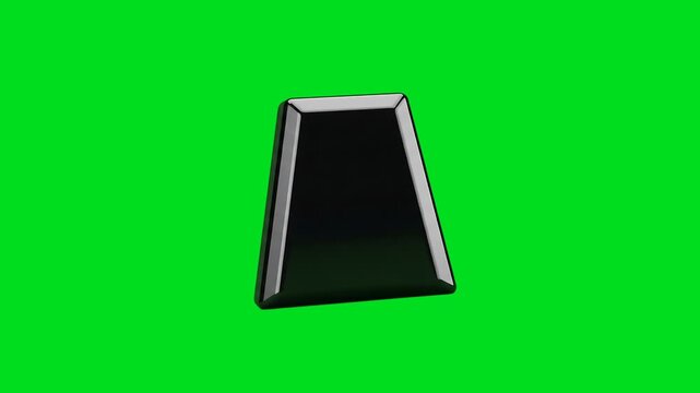 A shiny black trapezoidal 3d object isolated against a vibrant green screen