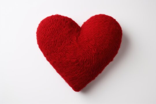 Red knitted woolen heart shape celebrating romantic love and valentine's day