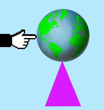 Digital hand points at a globe balancing on a triangle