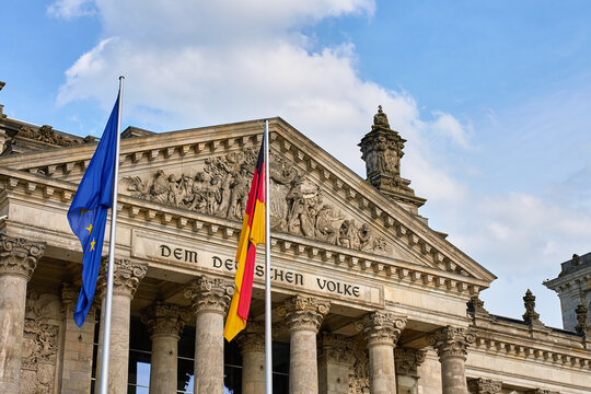 Reichstag building and flags in Berlin, Germany