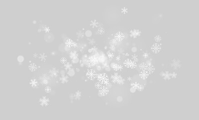 Fototapeta premium Scattered white snowflakes and soft bokeh lights glowing on a black background on transparent background