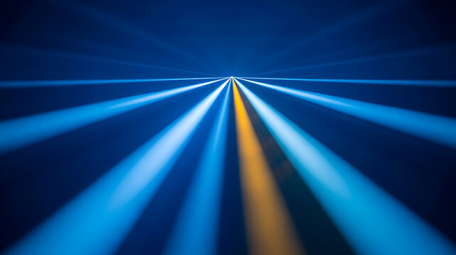 Blue and yellow light streaks receding into a vanishing point on a dark background 