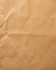 Fototapeta premium Vintage brown crumpled paper texture with deep folds and aged parchment surface, rustic craft paper background for scrapbook, stationery, posters and creative design.