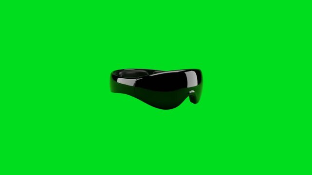 A sleek black futuristic visor centered against a vibrant chroma green background