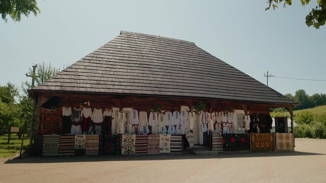 A Bucovinian house shows traditional clothes on display. The video captures the vibrant national costumes and the cultural heritage of the region.