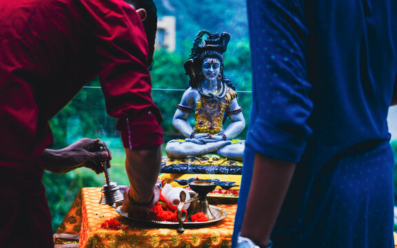 Hindu Devotees Performing Traditional Puja Worship at Ganga River in Rishikesh