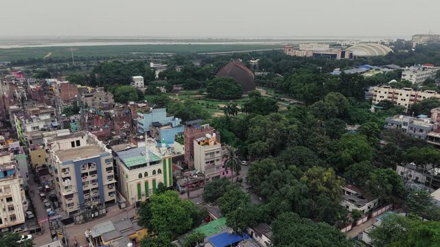 Aerial drone view of Golghar, a massive dome-shaped historic granary in Patna, Bihar, India. The iconic 18th-century monument is surrounded by lush greenery and the urban landscape of Patna.