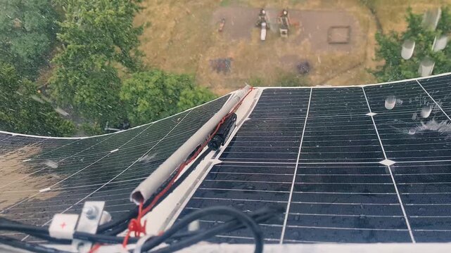 Raindrops Splashing on Flexible Balcony Solar Panels During Heavy Rainstorm