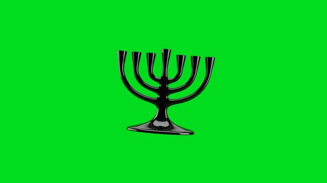 A sleek black menorah isolated against a vibrant solid green background