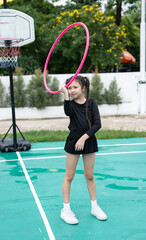 Kid girl playing Hula hoop © chachamp