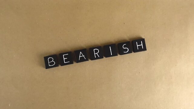 Individual black tiles spelling out the word bearish on a brown paper background, conceptualizing a negative or pessimistic outlook in the stock market and financial trading environment