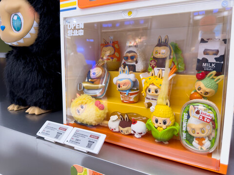 PENANG, MALAYSIA - JUL 21, 2026: Labubu collectible figures displayed inside transparent Pop Mart retail showcase.
