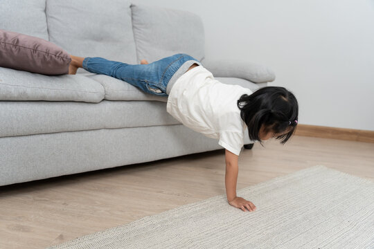 Happy Asia children play and learn funny activity at home. Play stunts. daughter having fun spending time, Activity, development, IQ, EQ, meditation, brain, muscles, essential skills.
