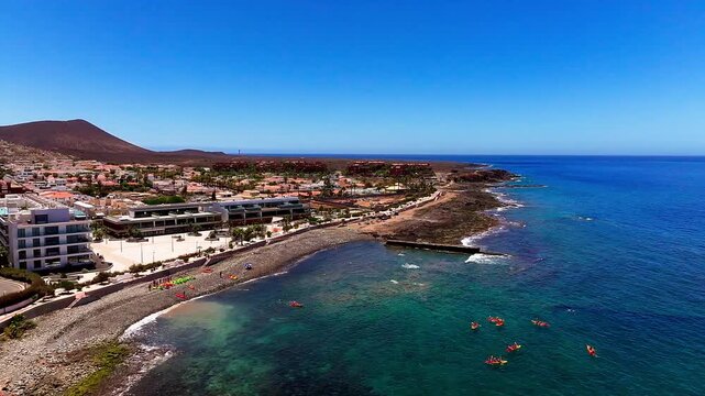 Aerial drone shot of coastal landscape and infrastructure at Punta del Bocinegro in Tenerife, Canary Islands. Tourism settlement travel destination. in Europe