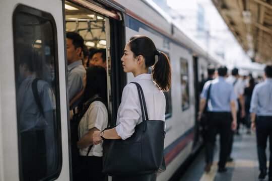 AI generated office worker boarding public transit during rush hour showing sustainable commuting crowded city travel daily transportation urban mobility