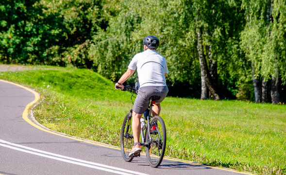 Cyclist ride on the bike path in the city Park
