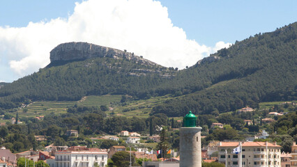 Naklejka premium Scenic View of Cassis Harbor Lighthouse and Cap Canaille Cliffs