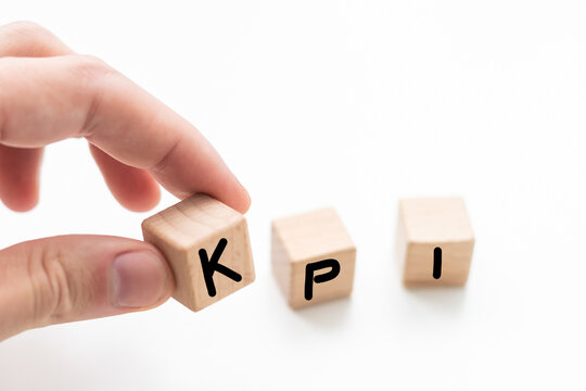 KPI, key performance indicator symbol. Concept word KPI, key performance indicator on wooden cubes on beautiful white background, copy space. Business, KPI, key performance indicator concept.