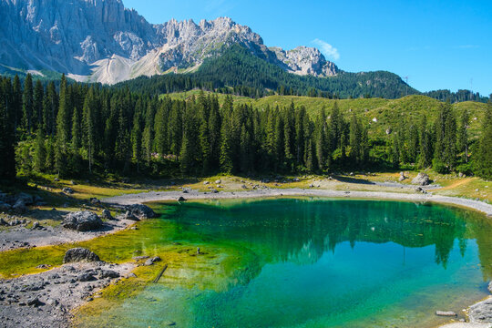 Dolomites mountain azure lake landscape with reflection in Italy, scenic European Alps turquoise water and nature travel concept