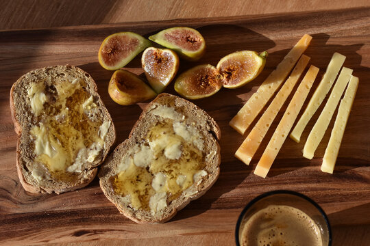 Rustic Mediterranean breakfast with figs, honey and cheese