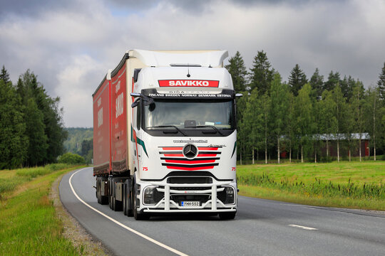 Custom Mercedes-Benz Actros L GigaSpace ProCabin semi-truck hauling trailer on the highway.