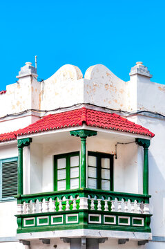 Traditional Canarian Corner Balcony With Green Wood And Red Roof