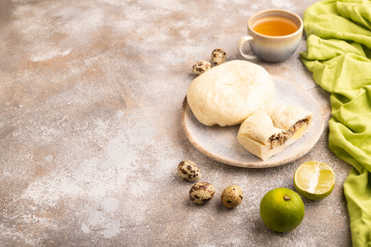 Vietnamese steamed buns Banh bao on brown concrete. side view, copy space