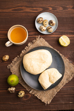 Vietnamese steamed buns Banh bao on brown wooden. top view, flat lay, close up