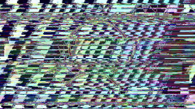 pixelated figure shifting through vibrant color bands and noise