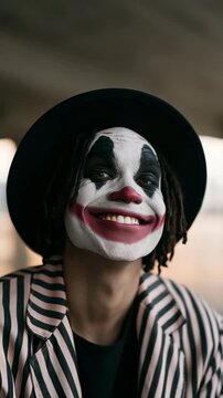 Smiling clown portrait with striped jacket and hat for character poster and theatrical banner