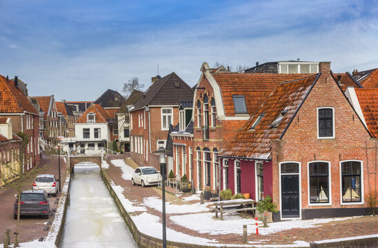 Little houses at the frozen canal of Dokkum, Netherlands