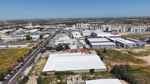 Aerial drone view of Ofakim city and industrial area in southern Israel with urban landscape and infrastructure