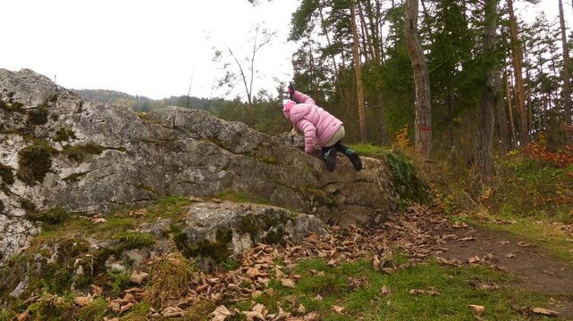 Little beautiful girl walks in Slovak Paradise, Slovakia