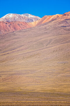 Peru, South America: aerial view of Palccoyo rainbow mountain, a mountain range in the Andes, 5.000 meters above sea level, with colourful stripes caused by natural mineral and clay weathering