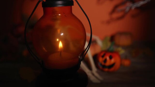 Lantern lifted away to reveal skeleton and pumpkin Halloween scene for party decor, spooky backdrops and autumn design